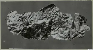Crumpled thin metal sheet, torn into several joined pieces, from Idalion