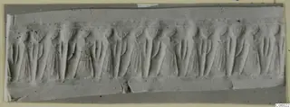 Seal impression with a continuous row of upright figures carved in shallow relief