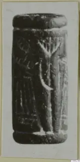 Cylinder seal from Idalion in dark stone, with an incised design of a branched motif and vertical lines
