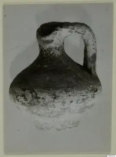 Pottery Black Slip I-VI: round-bodied jug with a strap handle