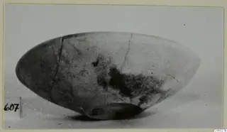 Pottery Plain White bowl, side view, with cracks and dark staining on its surface