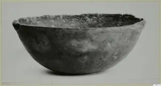 Deep rounded bowl with a rough, uneven rim, seen from the side against a plain background, Idalion