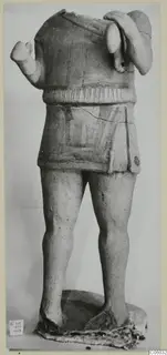 Headless terracotta figure with raised arms and a painted short garment, from Ayia Irini