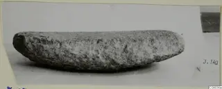 Stone grinder seen from the side, a find from Idalion, shown on a pale surface