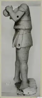 Terracotta standing figure, Terracotta Proto-Cypriote I, side view on a plinth, one arm raised toward the head