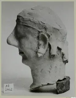 Terracotta head in profile facing left, from Ayia Irini, broken at the back of the head and at the neck