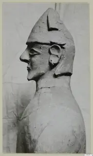 Terracotta Proto-Cypriote I: head and upper body of a figure seen in profile, wearing a tall pointed cap.