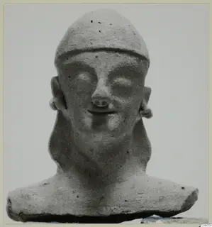 Head and bust of a figure with a close-fitting cap, large eyes and a small smile, shown against a plain background