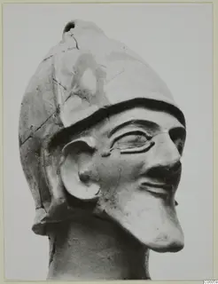 Terracotta Proto-Cypriote II, a head of a figure wearing a helmet, shown in three-quarter view