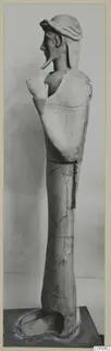 Terracotta Proto-Cypriote II, a tall standing statue shown in side view on a plinth