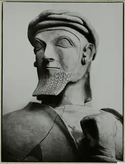 Terracotta statue of a bearded man with a ridged head covering and incised beard, from Ayia Irini