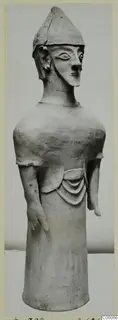 Terracotta figurine of a standing figure with a conical cap and arms at its sides, from Ayia Irini