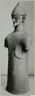 Terracotta Proto-Cypriote I, a tall standing figure with a conical hat and stumps where the arms were