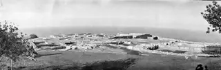 Panoramic view of the palace ruins at Vouni, with stone walls on a hilltop and the sea beyond