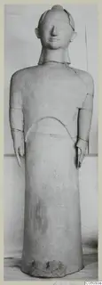 Standing terracotta figure with arms at its sides, shown frontally against a plain backdrop, with visible restoration joins.