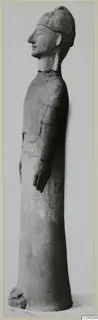 Tall terracotta standing figure in profile, wearing a cap, from Ayia Irini