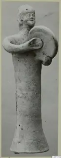 Terracotta statuette of a standing figure holding a round shield across its body, from Ayia Irini