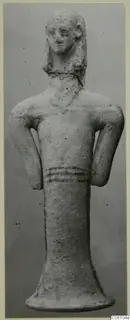 Terracotta standing figurine from Ayia Irini with arms bent at the sides and painted bands across the waist