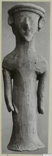 Terracotta statuette of a standing figure with a flat cap and disc-shaped ears, from Ayia Irini