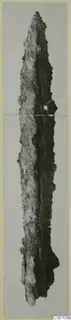 Corroded iron weapon, long and narrow, from the Amathus tombs series
