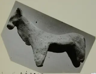 Terracotta figurine of a standing four-legged animal from Ayia Irini, shown in side profile