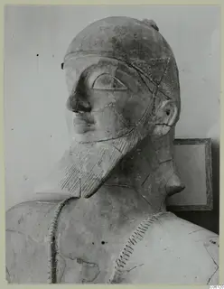 Terracotta Neo-Cypriote bust of a bearded figure with a dotted cap, shown in three-quarter view