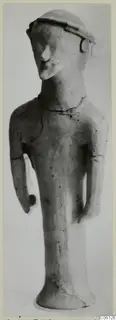 Terracotta statuette of a standing human figure with a flat-topped cap and arms held at its sides, from Ayia Irini