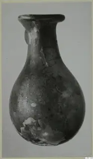 Blown glass vessel from Idalion with a flared rim, long narrow neck and rounded body