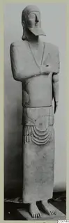 Standing Neo-Cypriote terracotta figure with arms folded across the chest