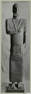 Terracotta statue of a standing figure from the Neo-Cypriote series, shown full length on a rectangular base