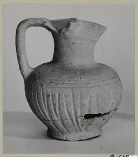 Ayia Irini pottery of Period 2: small jug with a loop handle and vertically grooved body