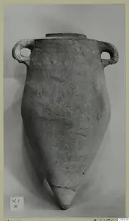 Pottery Plain White VI pithos from Vouni, with two loop handles, a flat rim and a pointed base