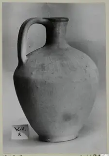 Pottery Plain White VI jug with a single loop handle and wide body, photographed against a grey backdrop.