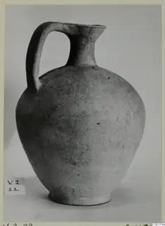 Pottery Plain White VI jug from Vouni, with a single strap handle and a narrow neck