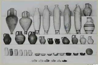 Pottery vessels from Vouni Tomb 7 set out in rows: two-handled amphorae, jugs, juglets and bowls.