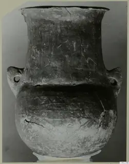 Pottery Red Polished III amphora with a flared neck, two lug handles and incised band decoration on the body