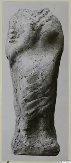 Terracotta figurine fragment from Vouni, standing upright with a face-like profile at upper left