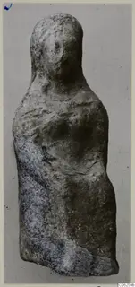 Terracotta figurine of a standing figure from Vouni, with traces of blue paint