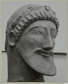 Bearded head sculpture from Mersinaki, shown in three-quarter view against a pale backdrop