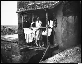 The Gjerstad family standing on a wooden balcony at Ayia Irini