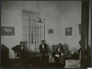 Four men in dark suits seated in a room in Nicosia, 1931