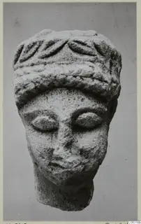 Limestone head with a leaf-patterned headband, from Kition
