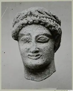Limestone sculpture of a head from Kition, front view