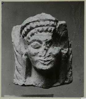 Limestone statuette head with a banded headdress, from Vouni