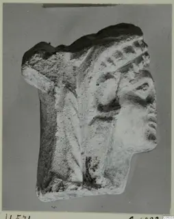 Limestone statuette fragment from Vouni showing a head in profile facing right, with a band across the hair