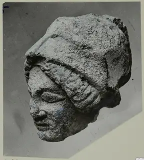 Limestone head from Vouni with a close-fitting headband, almond-shaped eyes, straight nose and small mouth