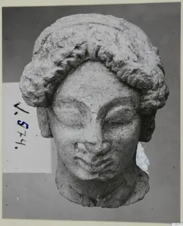 Limestone head fragment from Vouni, facing the camera