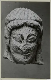 Limestone head from Vouni, front view, with a ridged headdress and large eyes