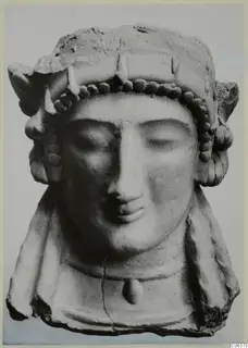 Terracotta bust of a woman with closed eyes, a beaded headband and a pendant on the chest