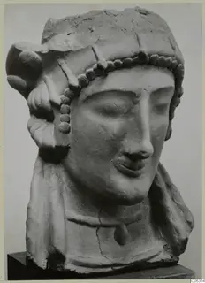 Head and bust of a woman with a bead band across the forehead, sculpture on a dark base